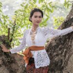 Portrait of a young woman in a traditional Indonesian kebaya, outdoors, Jakarta.