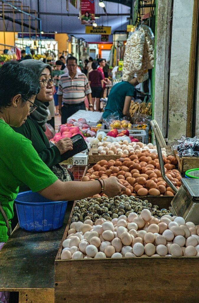 Vibrant market scene with a diverse selection of eggs in Banten, Indonesia.